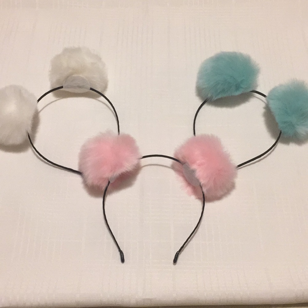 New in bag Pom Pom hair bands in various colors